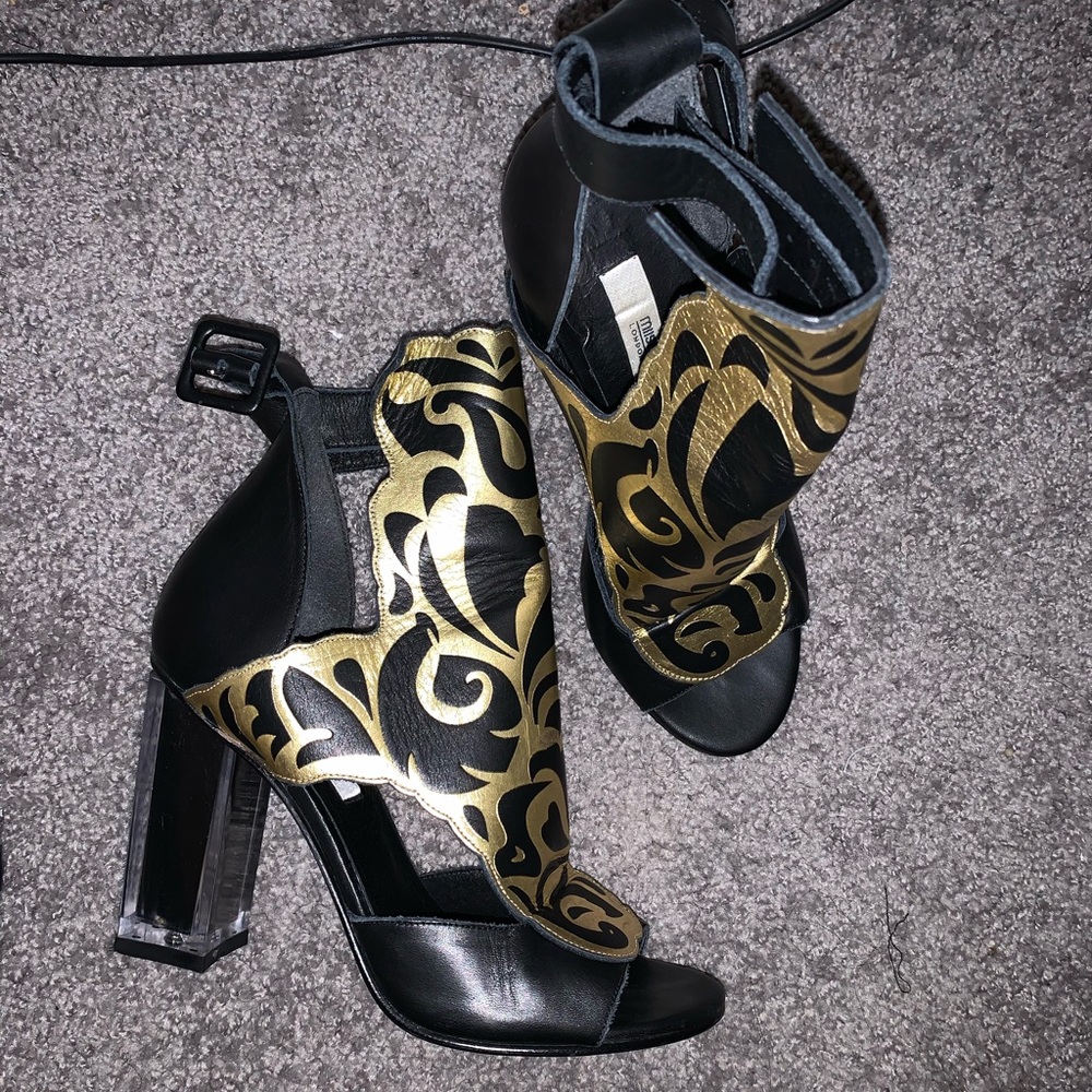Black and gold detailed heels